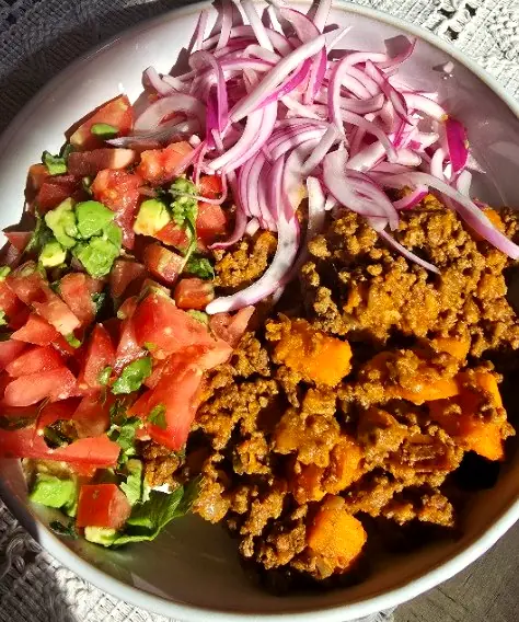 Spiced beef and roasted sweet potato with fresh tomato salsa and pickled red onion